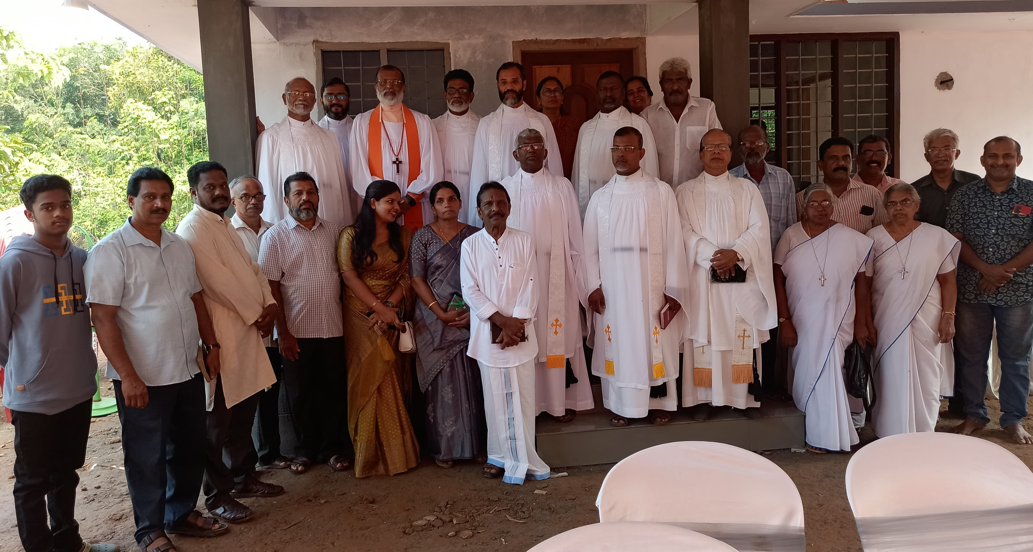 The Bishop of Madhya Kerala Diocese dedicated the newly built house for the church worker and his family.